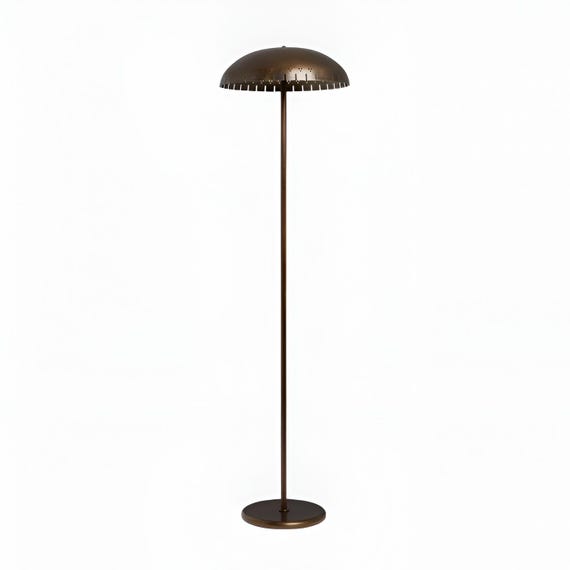A handmade Italian-style brass floor lamp that looks like it belongs in a Milan showroom — serious investment lighting with genuine retro flair.