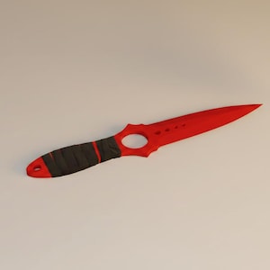 May include: A red dagger with a black and red handle. The blade has a pointed tip and a circular cutout near the handle. The handle is wrapped in black material with red accents. The dagger is designed for utility or display.