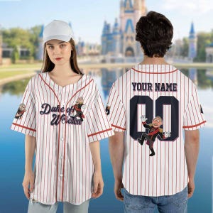 May include: White and red pinstripe baseball jersey with the text "Duke of Weselton" and a cartoon character on the front. The back features the text "YOUR NAME" above a large number and another cartoon character.
