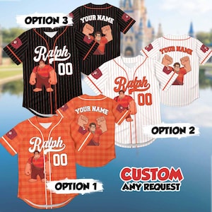 May include: Baseball jerseys in orange, black, and white, each featuring a cartoon character and the name "Ralph" with the number "00." The jerseys have the option to add a custom name. The image also includes the text "CUSTOM ANY REQUEST."