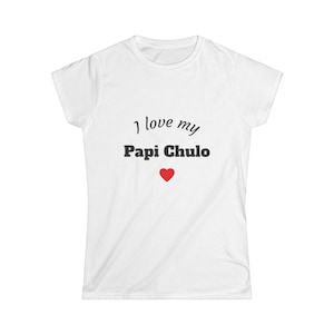 May include: White t-shirt with the text "I love my Papi Chulo" in black script and a red heart graphic. The shirt is a crew neck style.