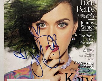 Revista "Entertainment" completa firmada por Katy Perry, certificado de autenticidad incluido.