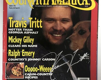 Revista "Country America" completa firmada por Travis Tritt, certificado de autenticidad incluido.