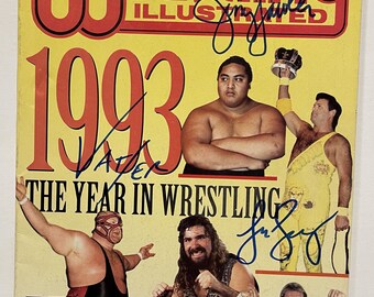 Revista "Wrestling" de 1993 firmada por King Jerry Lawler, Big Van Vader y Lex Lugar, con certificado de autenticidad incluido.