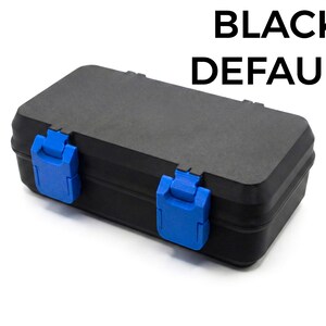 May include: A black rectangular case with blue latches. The text "BLACK DEFAULT" is printed in bold, black letters at the top. The case is closed and appears to be made of a durable material.