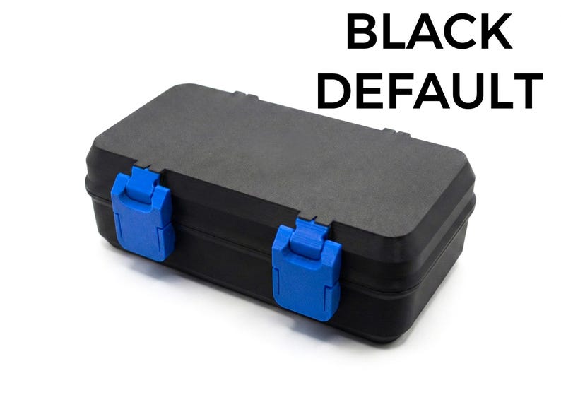 May include: A black rectangular case with blue latches. The text "BLACK DEFAULT" is printed in bold, black letters at the top. The case is closed and appears to be made of a durable material.