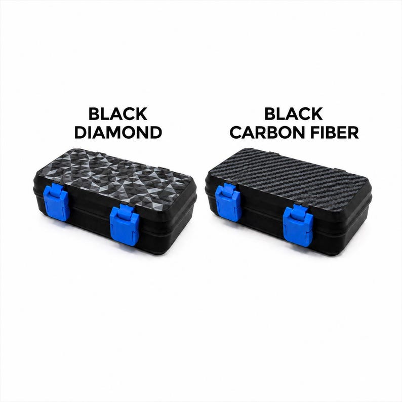 May include: Two black rectangular cases with blue clasps. One case has a diamond pattern, and the other has a carbon fiber texture. The text above the cases reads "BLACK DIAMOND" and "BLACK CARBON FIBER."