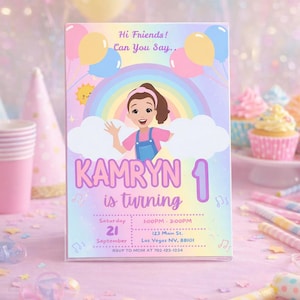 May include: A pastel-colored birthday invitation with the name "Kamryn" and the number "1" prominently displayed. The invitation features a cartoon illustration of a girl, balloons, and a rainbow. Additional details include the date, time, and location.