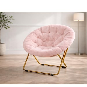 May include: A pink, tufted, round accent chair with a gold-colored metal frame. The chair has a plush, velvety texture and a low profile. The chair is designed for comfort and relaxation, suitable for a living room or bedroom.