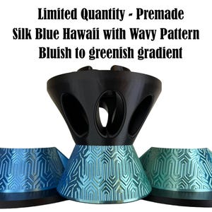 May include: A 3D printed object with a black top section featuring oval cutouts and a base with a wavy pattern in a silk blue to greenish gradient. Text reads: Limited Quantity - Premade, Silk Blue Hawaii with Wavy Pattern, Bluish to greenish gradient.