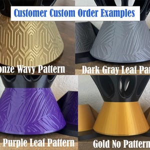 May include: A collage of four conical objects with black tops. The top left is bronze with a wavy pattern. The top right is dark gray with a leaf pattern. The bottom left is dark purple with a leaf pattern. The bottom right is gold with no pattern.