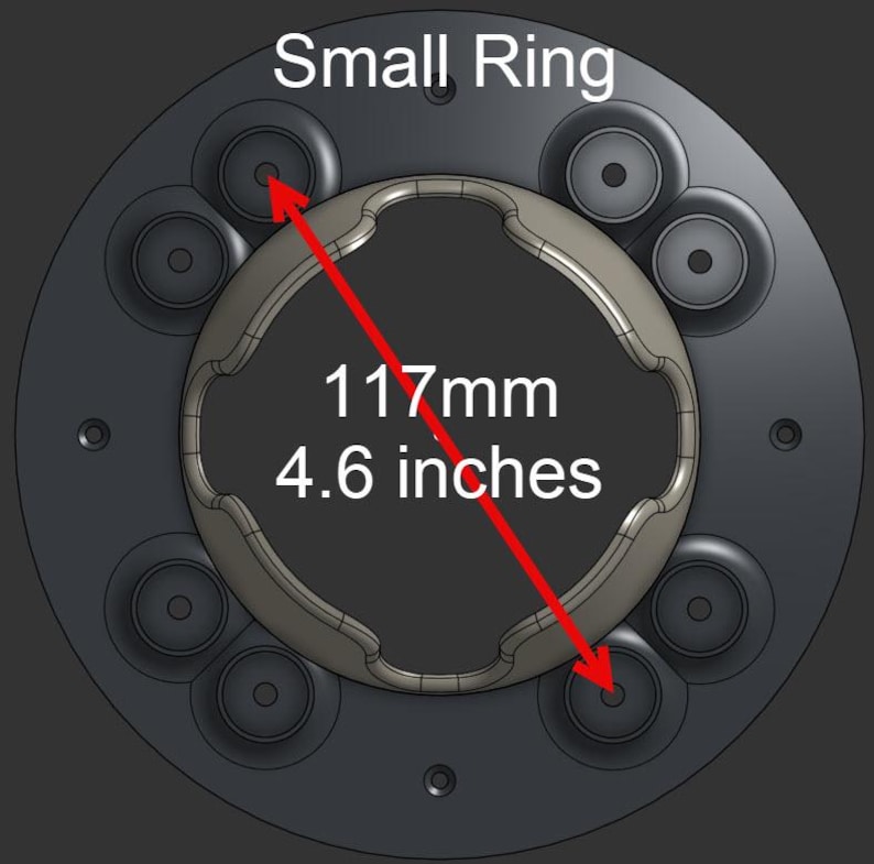 May include: A circular black component labeled Small Ring with a central metallic insert featuring a wavy edge. A red arrow indicates a diameter measurement of 4.6 inches between two circular mounting points on the dark gray base plate.