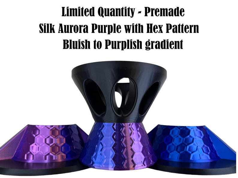May include: A set of three objects with a black top section featuring oval cutouts and a base with a hexagonal pattern. The base displays a gradient from blue to purple. Text reads: Limited Quantity - Premade Silk Aurora Purple with Hex Pattern Bluish to Purplish gradient.