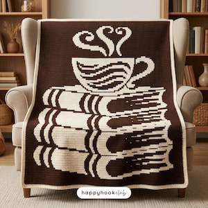 May include: A rectangular crochet blanket featuring a dark brown background with a cream-colored graphic design. The pattern depicts a stack of three books topped with a steaming cup of coffee. The text "happyhookclub" is printed at the bottom.