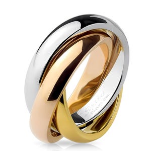 May include: A white ceramic mug with a black handle and the text "But First, Coffee" in a black, handwritten-style font. The mug is on a white surface.