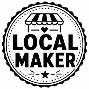 May include: A black and white circular logo with the words "LOCAL MAKER" in bold letters. The design includes a stylized shop awning, a heart, and a star, all within a dotted border and a scalloped edge.