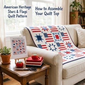 May include: A quilt pattern titled American Heritage Stars & Flags How to Assemble Your Quilt Top, featuring a red, white, and blue star and flag design. The pattern is displayed on a stand next to a stack of fabric, pincushions, and scissors.