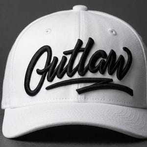 May include: A white baseball cap with the word "Outlaw" embroidered in black script across the front. The hat has a curved brim and a button on top. The background is a solid gray.