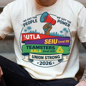 Labor movement PNG union strong workers rights protest design featuring a raised fist holding a red megaphone above a city skyline with palm trees, layered banners displaying UTLA SEIU Teamsters AALA and “Union Strong 2026” text, bold modern activist style with vibrant red, teal, green, and yellow colors, ideal for shirt sublimation, protest apparel, and digital download PNG file for union supporters and activists