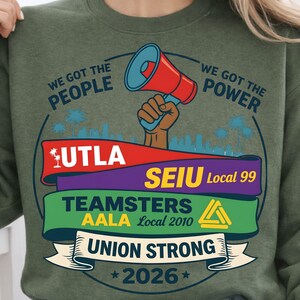 Labor movement PNG union strong workers rights protest design featuring a raised fist holding a red megaphone above a city skyline with palm trees, layered banners displaying UTLA SEIU Teamsters AALA and “Union Strong 2026” text, bold modern activist style with vibrant red, teal, green, and yellow colors, ideal for shirt sublimation, protest apparel, and digital download PNG file for union supporters and activists