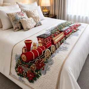 May include: A quilted bed runner featuring a detailed red steam locomotive train design. The train is decorated with green pine branches, red poinsettia flowers, and gold accents. The runner is placed on a white bedspread with matching pillows.