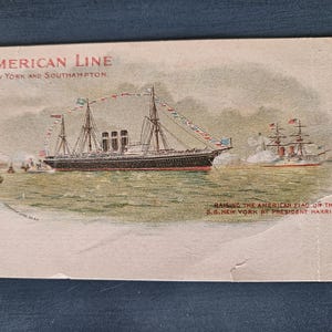May include: Vintage postcard featuring a detailed illustration of the S.S. New York, a ship from the American Line, with the text "AMERICAN LINE, NEW YORK AND SOUTHAMPTON." The image depicts the raising of the American flag by President Harrison.