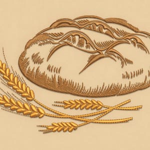Può includere: Un disegno ricamato con una pagnotta di pane e spighe di grano. Il pane è marrone chiaro con dettagli marrone scuro e il grano è giallo dorato. Il disegno è su uno sfondo marrone chiaro.