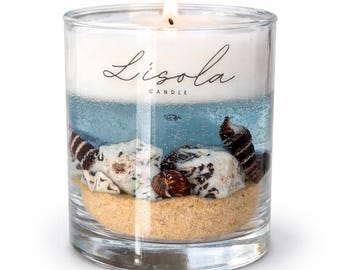 Vela con temática oceánica, arena y conchas marinas / Decoración costera con temática playera