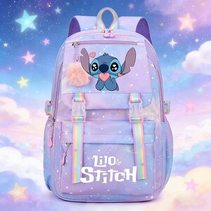 May include: A purple and blue backpack featuring a cartoon character holding a heart. The backpack has rainbow straps, a fluffy pink charm, and the words "Lilo & Stitch". The background is a starry sky.