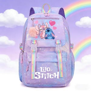 May include: A purple and blue backpack featuring the characters Stitch and Angel, with a rainbow and star pattern. The backpack has adjustable straps, a top handle, and a front pocket with the words "Lilo & Stitch". A pink pom-pom and heart accents complete the design.
