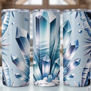 May include: Three stainless steel tumblers with a wraparound design of blue and white crystals. The design features geometric crystal formations on a light blue background, creating a cool, icy aesthetic.