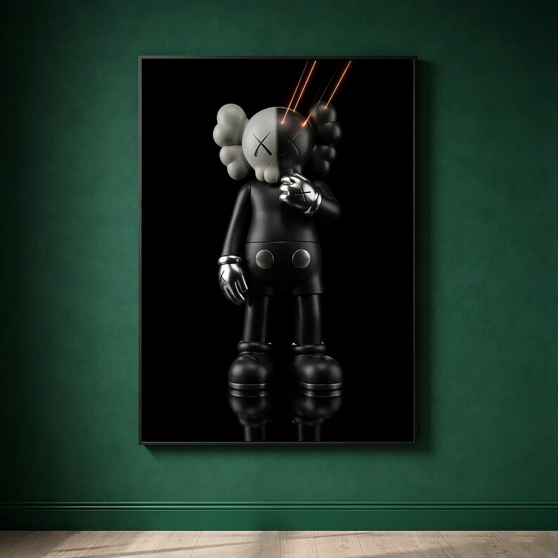 May include: A framed wall art print featuring a stylized black and white character figure with X-shaped eyes. The figure has a split-tone head, metallic silver hands, and two thin orange light beams emanating from the eyes against a solid black background.