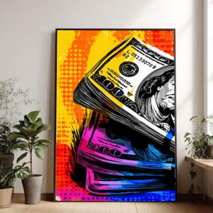 Puede incluir: Una impresión artística enmarcada que presenta una representación estilizada de una pila de billetes de cien dólares. La obra de arte utiliza colores vibrantes, incluyendo amarillo, naranja, rosa y azul, con un marco negro. Los billetes son parcialmente visibles, mostrando el retrato de Benjamin Franklin.
