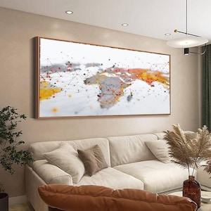 May include: A framed print of a world map, depicting continents with a network of dots and lines. The artwork uses a palette of white, orange, yellow, and black. The frame is brown. The artwork is a modern home decor piece.