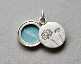 handmade round photo locket with delicate dandelions in sterling silver