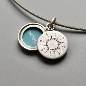 tiny silver picture locket with sun design image 1