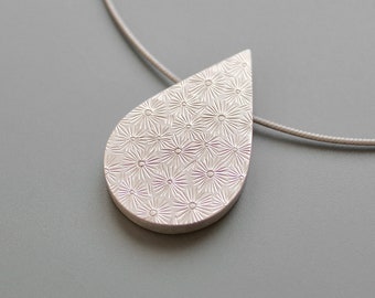 beautiful drop shaped picture locket in Sterling Silver with unique handmade pattern