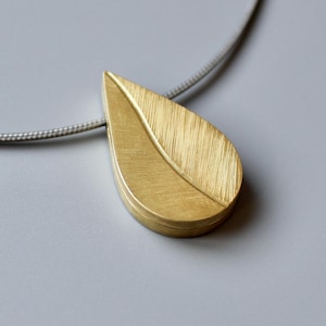 Élégant médaillon feuille pour deux photos en or jaune 18 carats