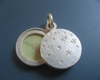 small double sided locket with starry night design in sterling silver