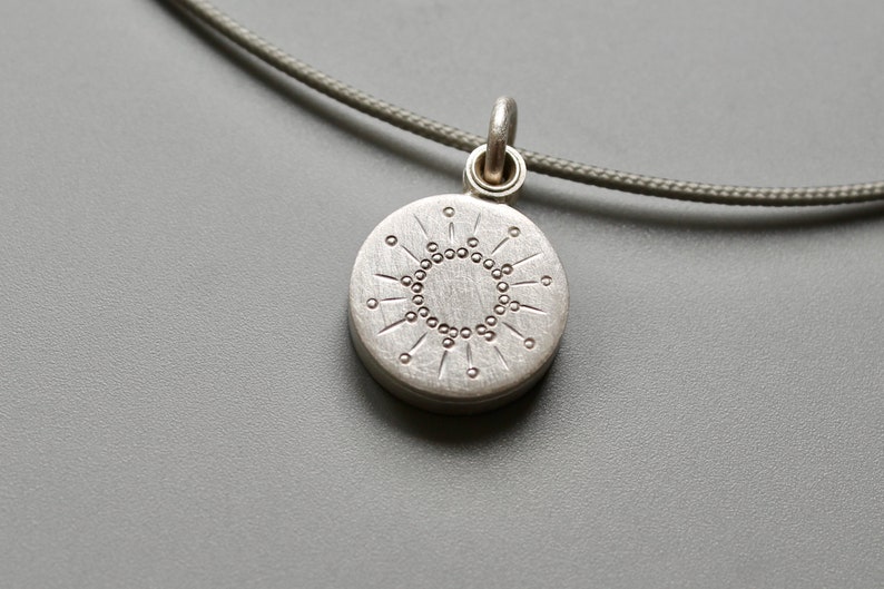 tiny silver picture locket with sun design image 4