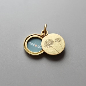 elegant golden picture locket with dandelions