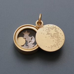Drijvend medaillon met vallende ster in 18 kt goud