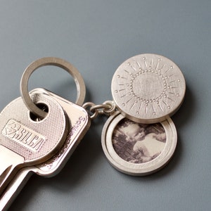 silver keychain locket for two pictures with sun decor image 1