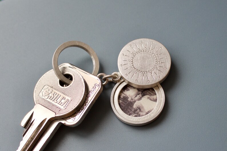 silver keychain locket for two pictures with sun decor image 1