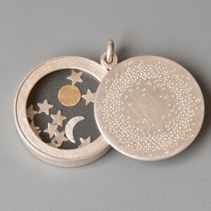 unique sterling silver locket with sun moon and stars