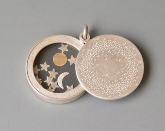 unique sterling silver locket with sun moon and stars