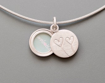 Romantic modern locket in sterling silver with two hearts