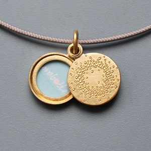 small golden locket for one picture with 1000 dots design image 1