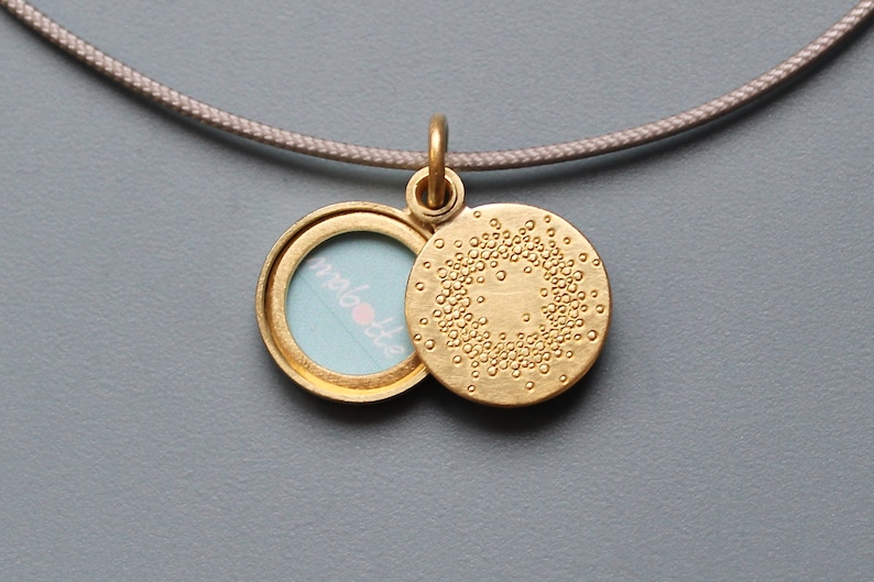 small golden locket for one picture with 1000 dots design image 1