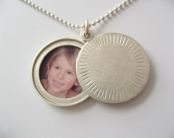 modern silver locket for one picture with aureole